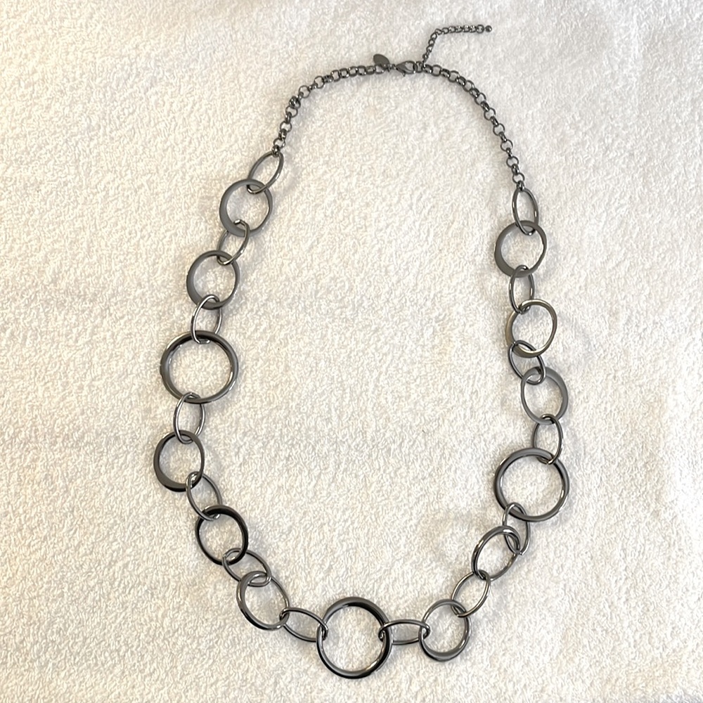 Gunmetal colored long necklace.